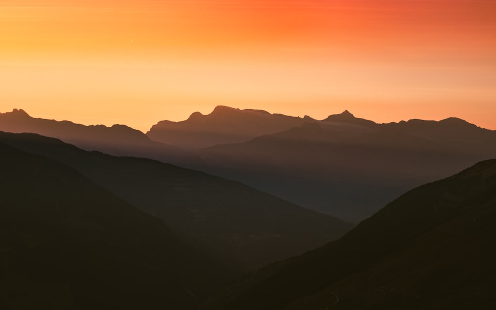 silhouette of mountains during sunset