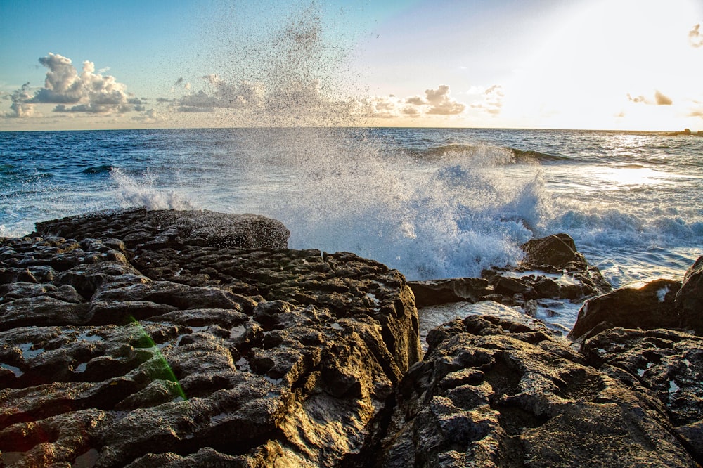 brown rock formation near sea during daytime