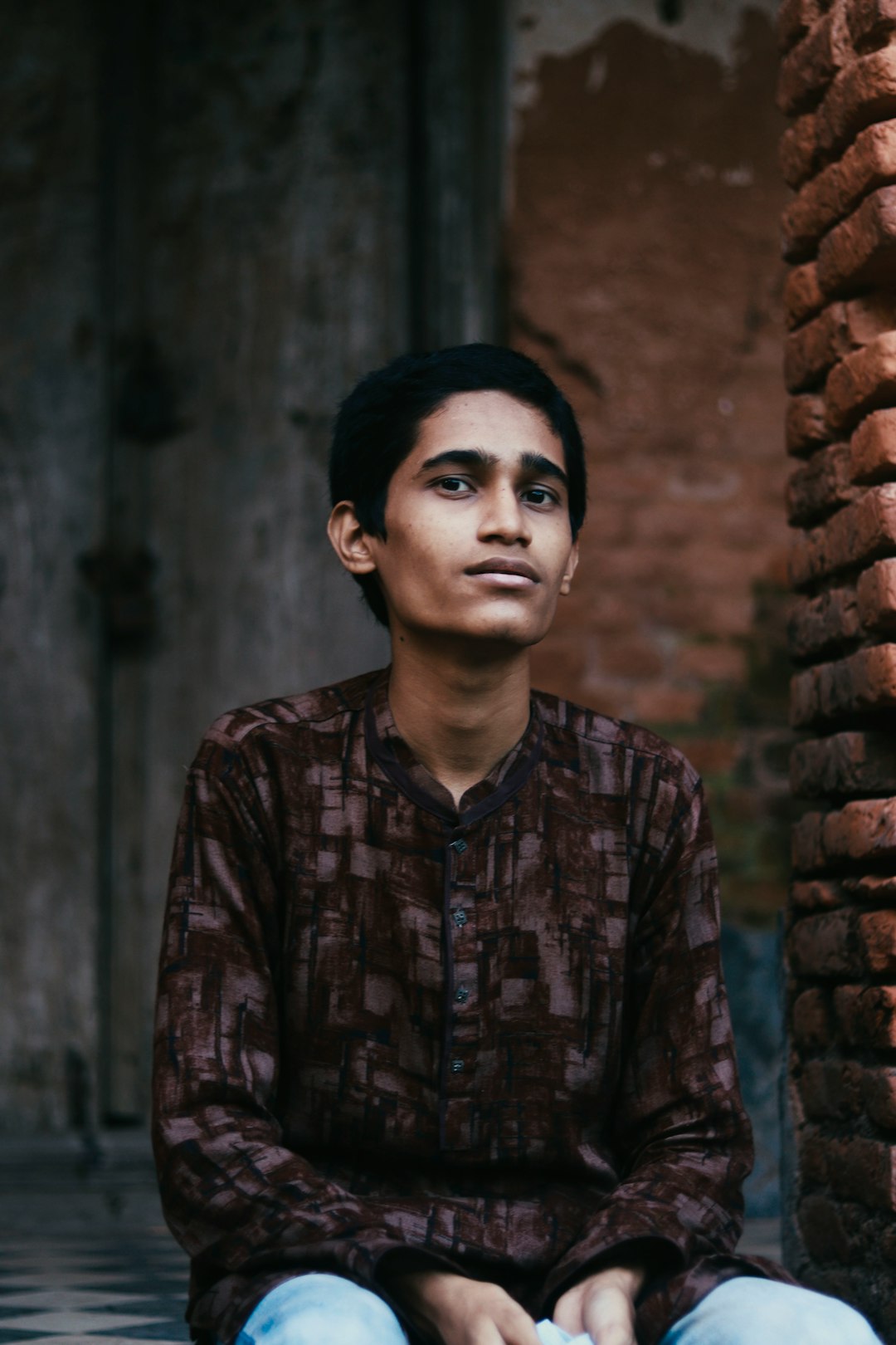 man in brown and black button up shirt