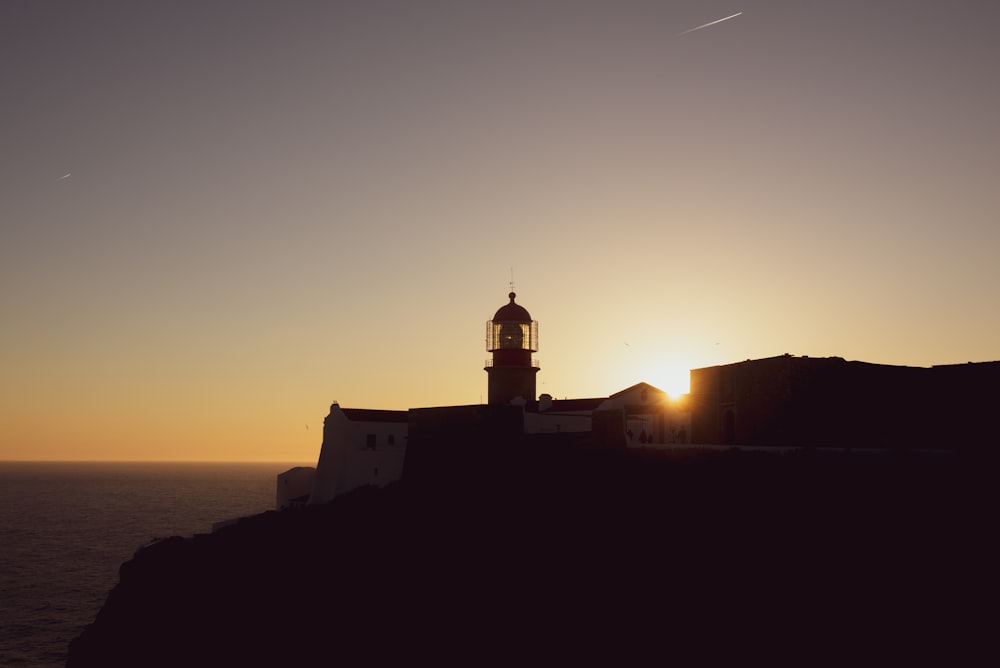 silhouette of building during sunset