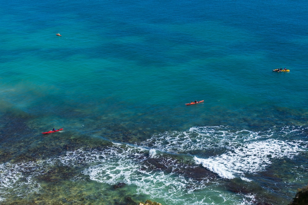 person surfing on sea waves during daytime