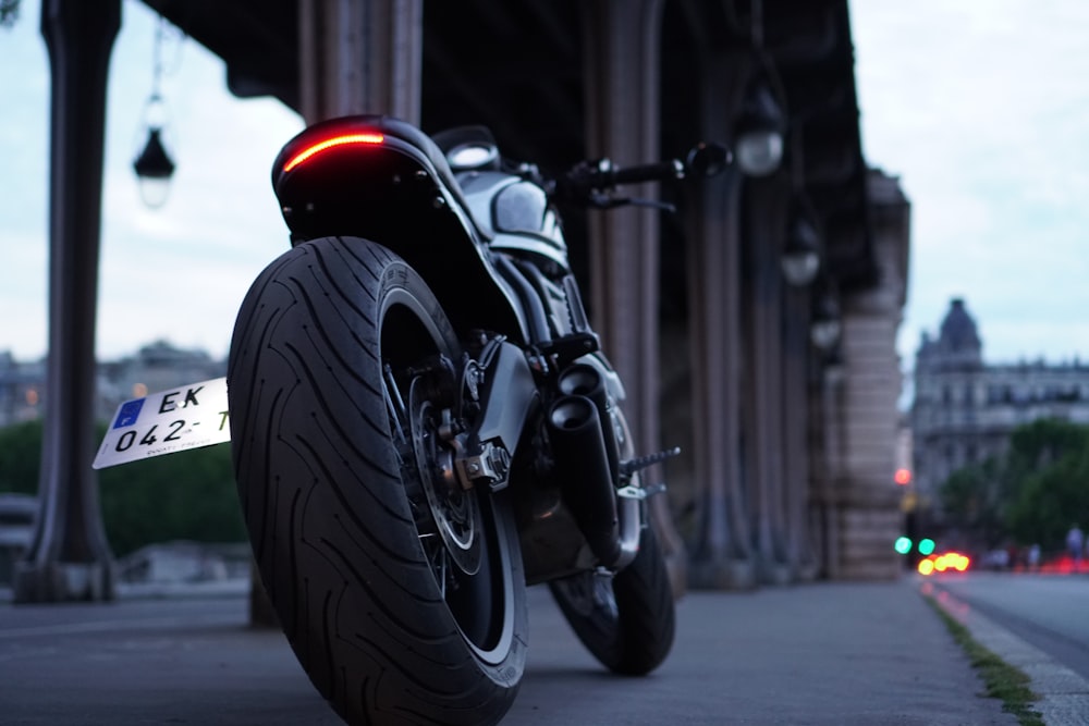 black motorcycle on road during daytime