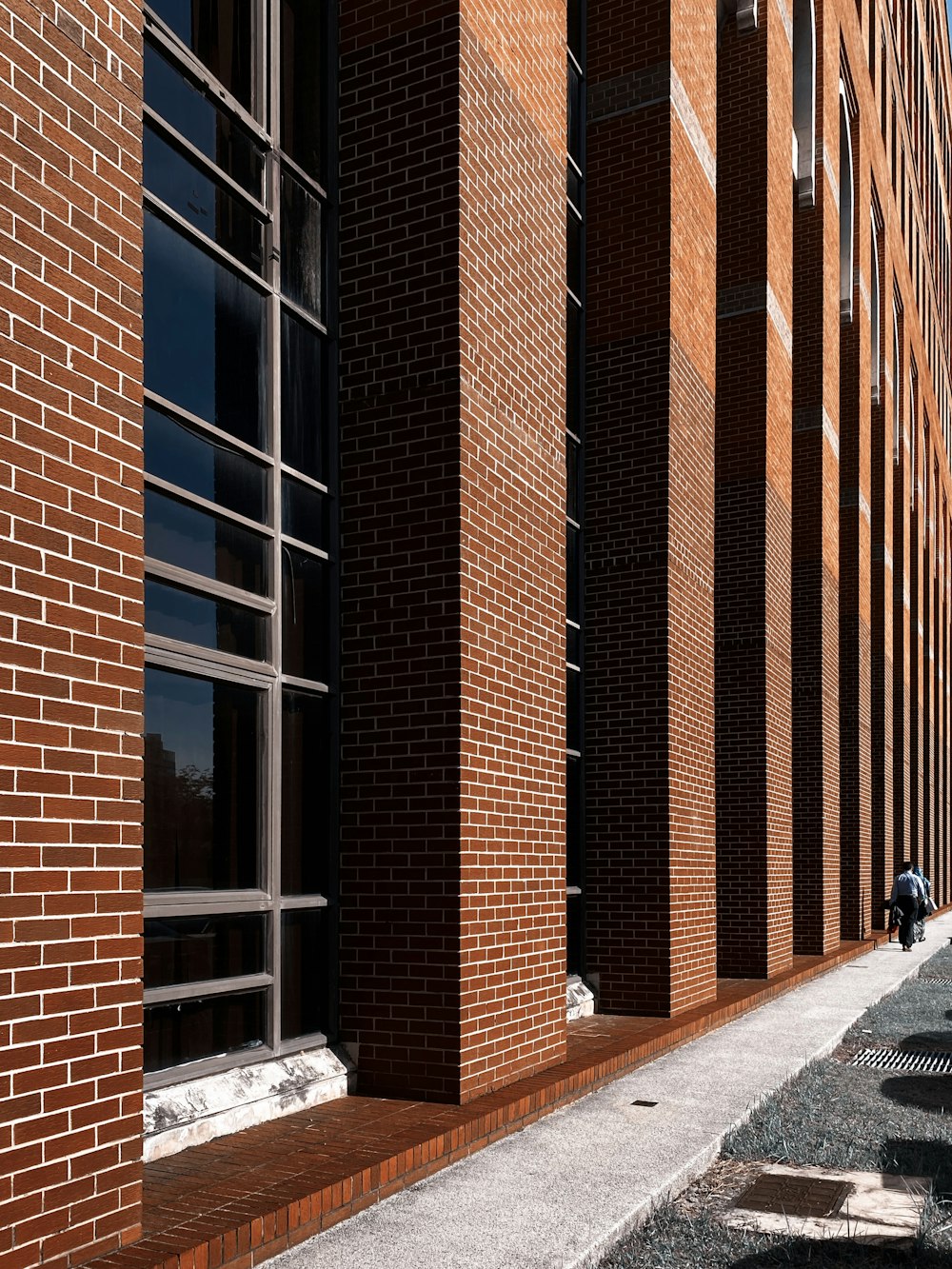 brown brick building with glass windows