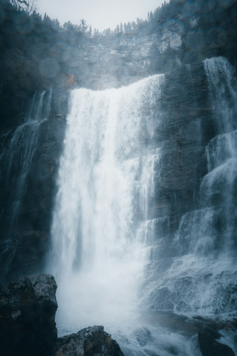 water falls on rocky mountain