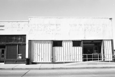 Before and after images of a commercial storefront rehabilitation.