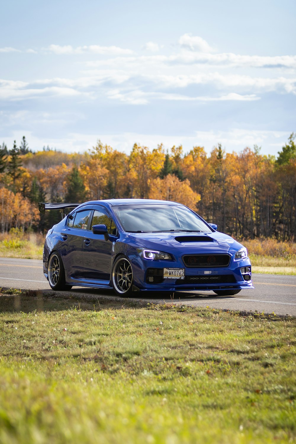 blue bmw m 3 on road during daytime