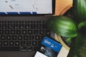 blue and white visa card on black and gray laptop computer