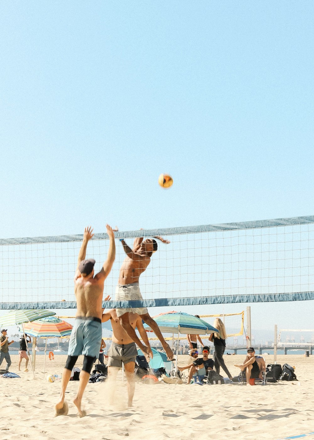 people playing volleyball during daytime
