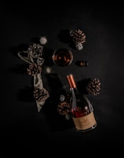 An atmospheric photo of a cozy tasting setup featuring glasses of Cognac and aged barrels in the background.