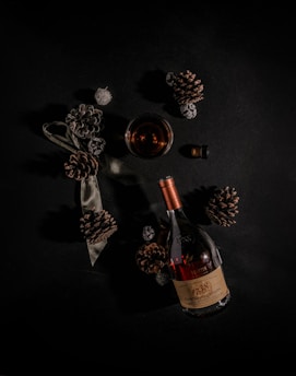 A rustic scene featuring a classic brandy decanter with rich brown hues.