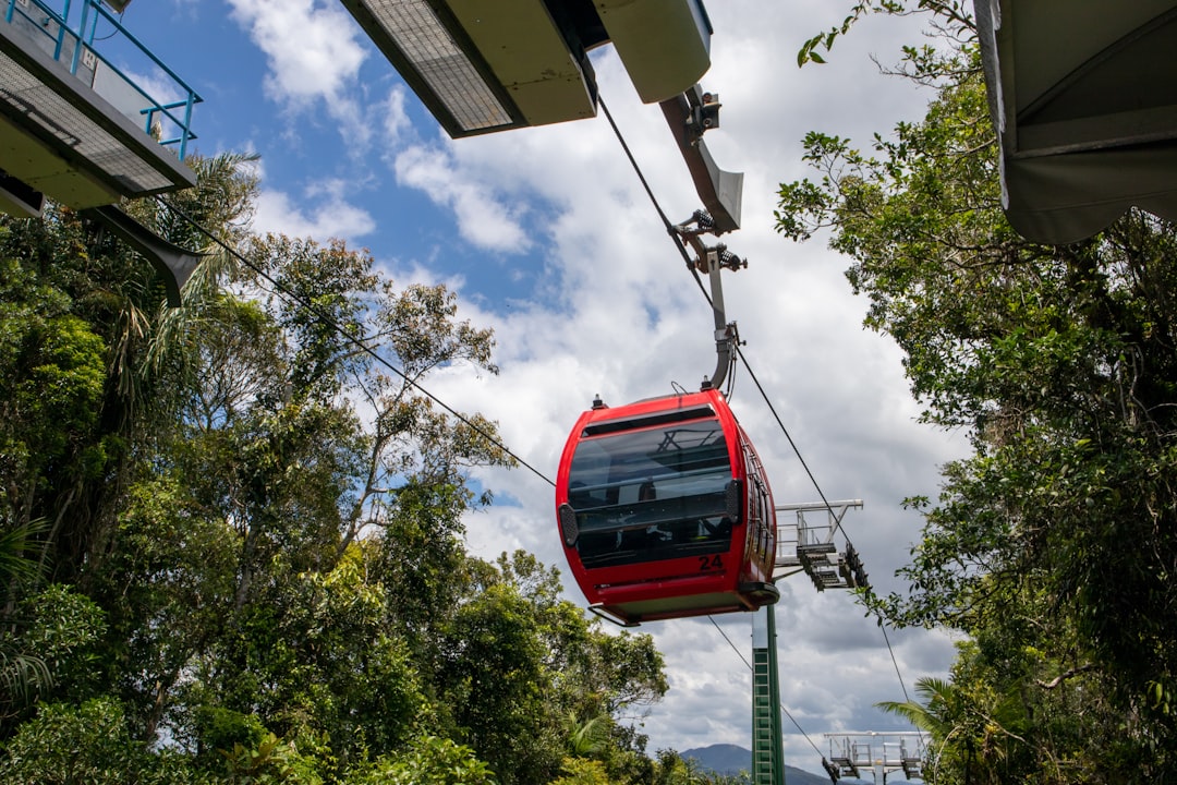 red cable car under blue sky during daytime