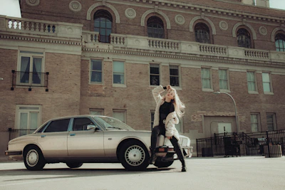 Modelvista posing elegantly against an urban backdrop, showcasing style and confidence.