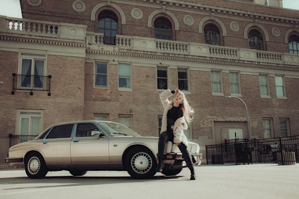 A stylish model posing confidently in an urban environment.