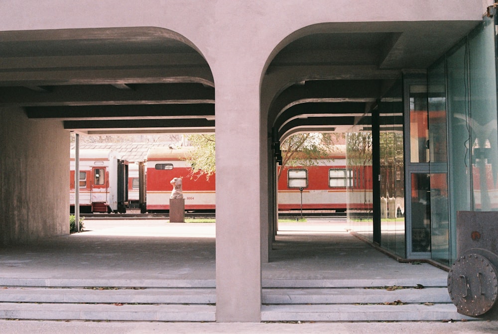 red and white train on train station during daytime