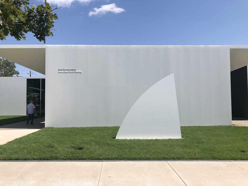 white concrete building near green grass field during daytime