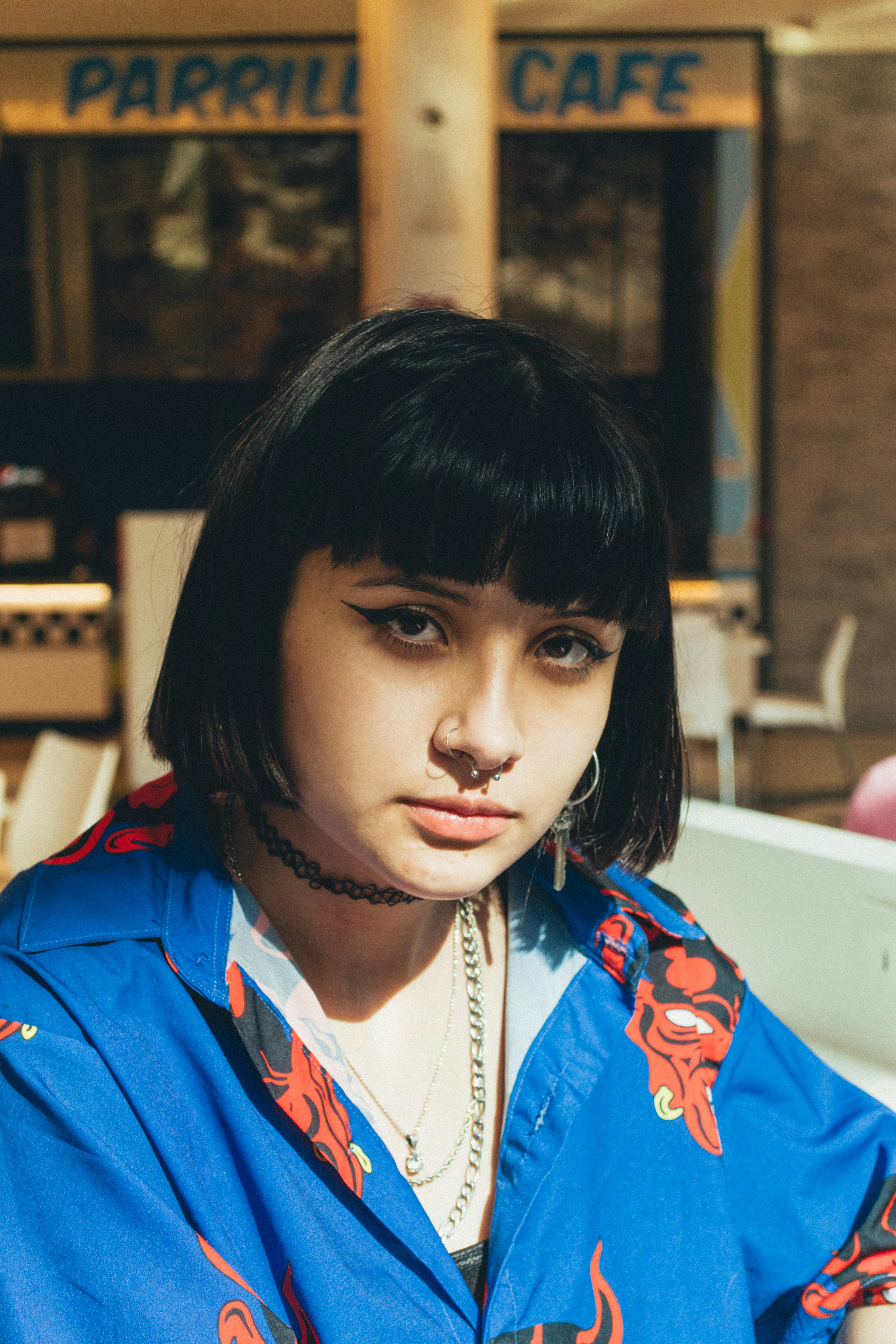 woman in blue and red collared shirt