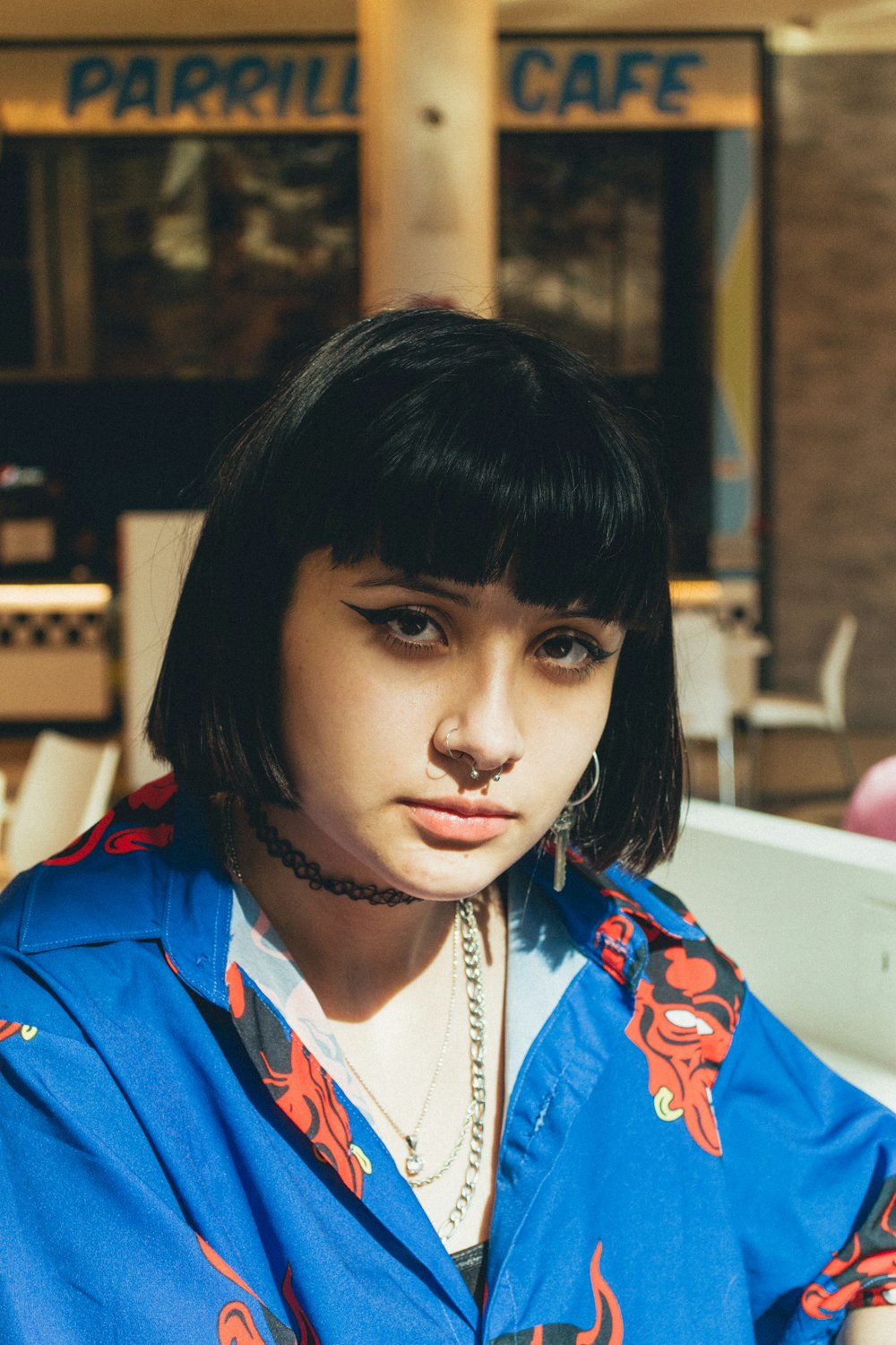 woman in blue and red collared shirt