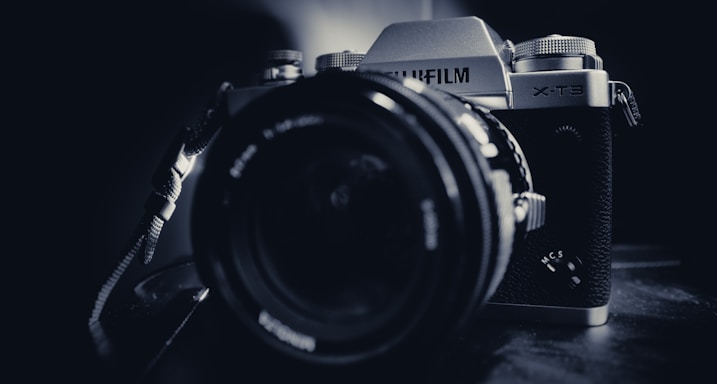 black and silver nikon dslr camera