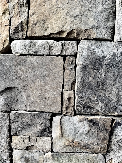 gray and black stone block wall