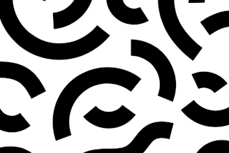 A vibrant digital pattern featuring colorful geometric shapes on a clean white background.