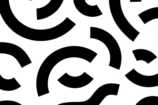 A vibrant digital pattern featuring colorful geometric shapes on a clean white background.