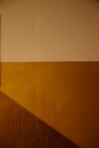 white wall paint with brown textile