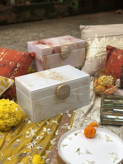 A tasteful arrangement of retro Chinese style wooden souvenir boxes adorned with intricate patterns and warm tones.