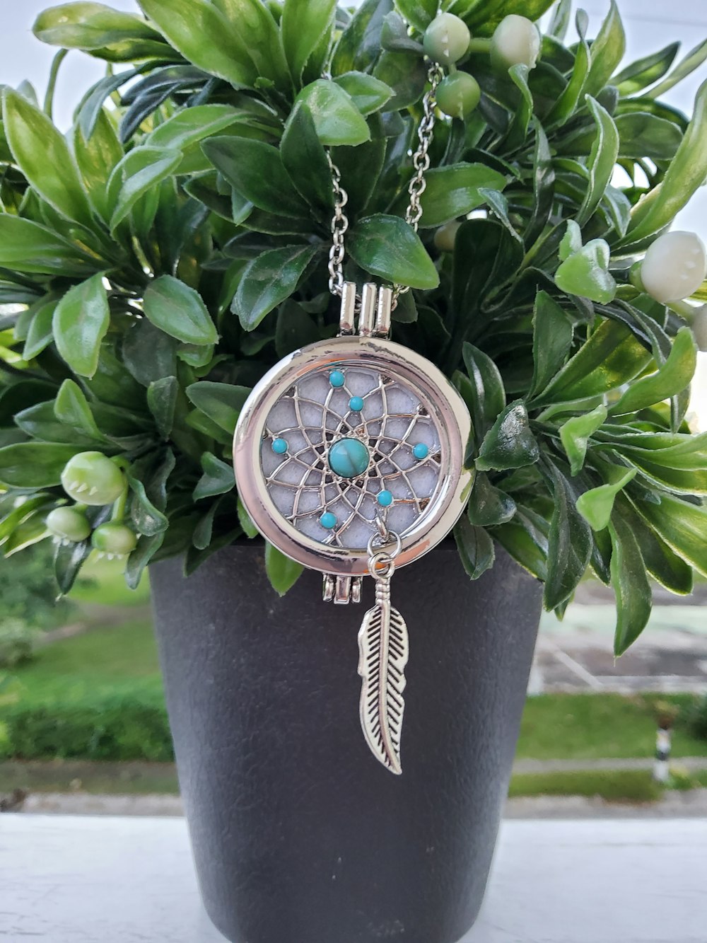 silver and blue round pendant necklace