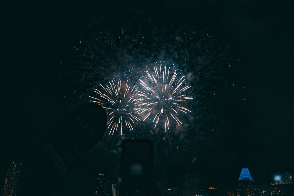 white and blue fireworks during nighttime