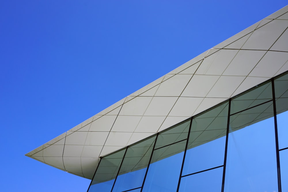 white and black concrete building under blue sky during daytime