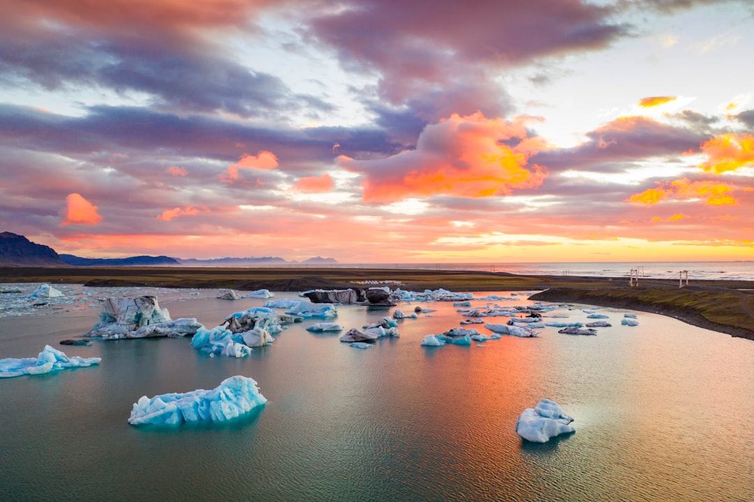 ice on water under cloudy sky during daytime