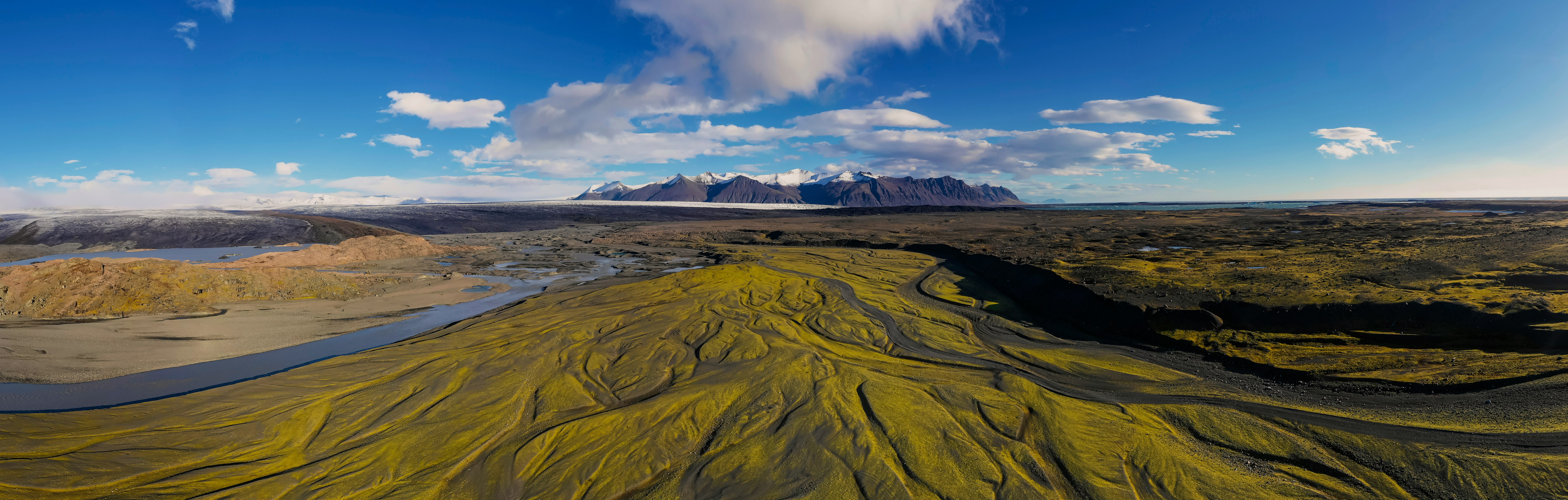 brown and green mountain under blue sky during daytime