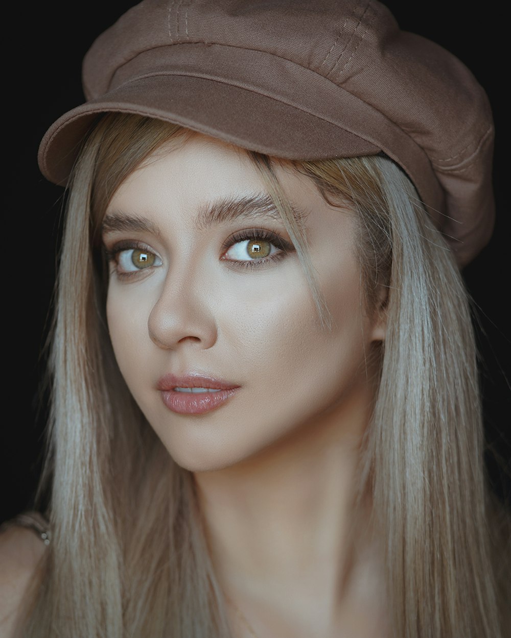 woman in brown hat and black shirt