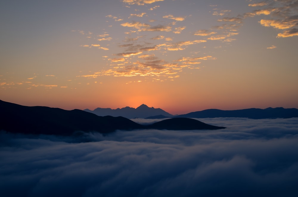 silhouette of mountains during sunset