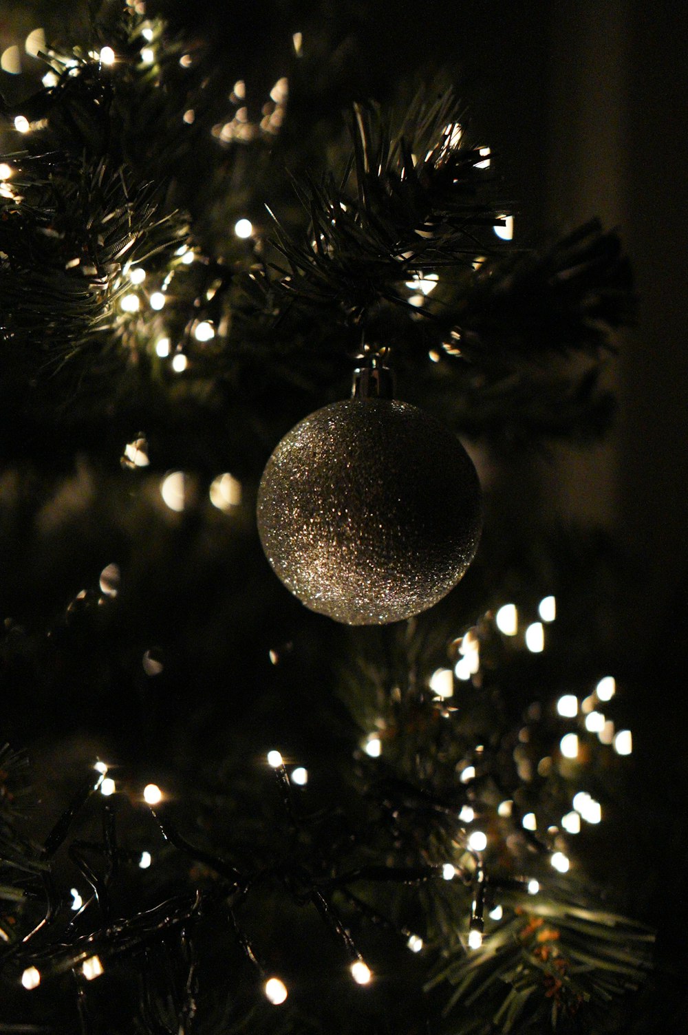 silver bauble on christmas tree