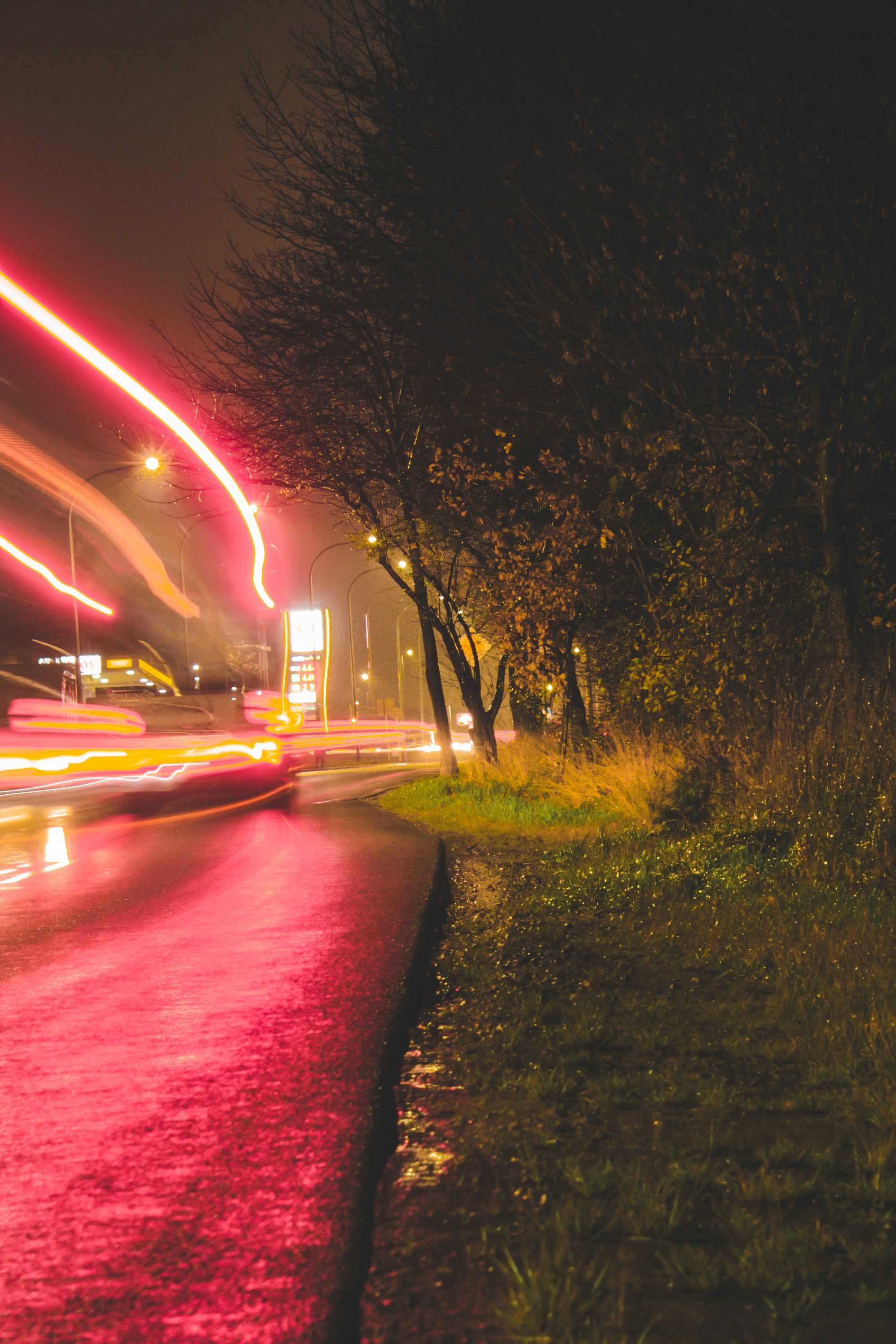 red light on road during night time