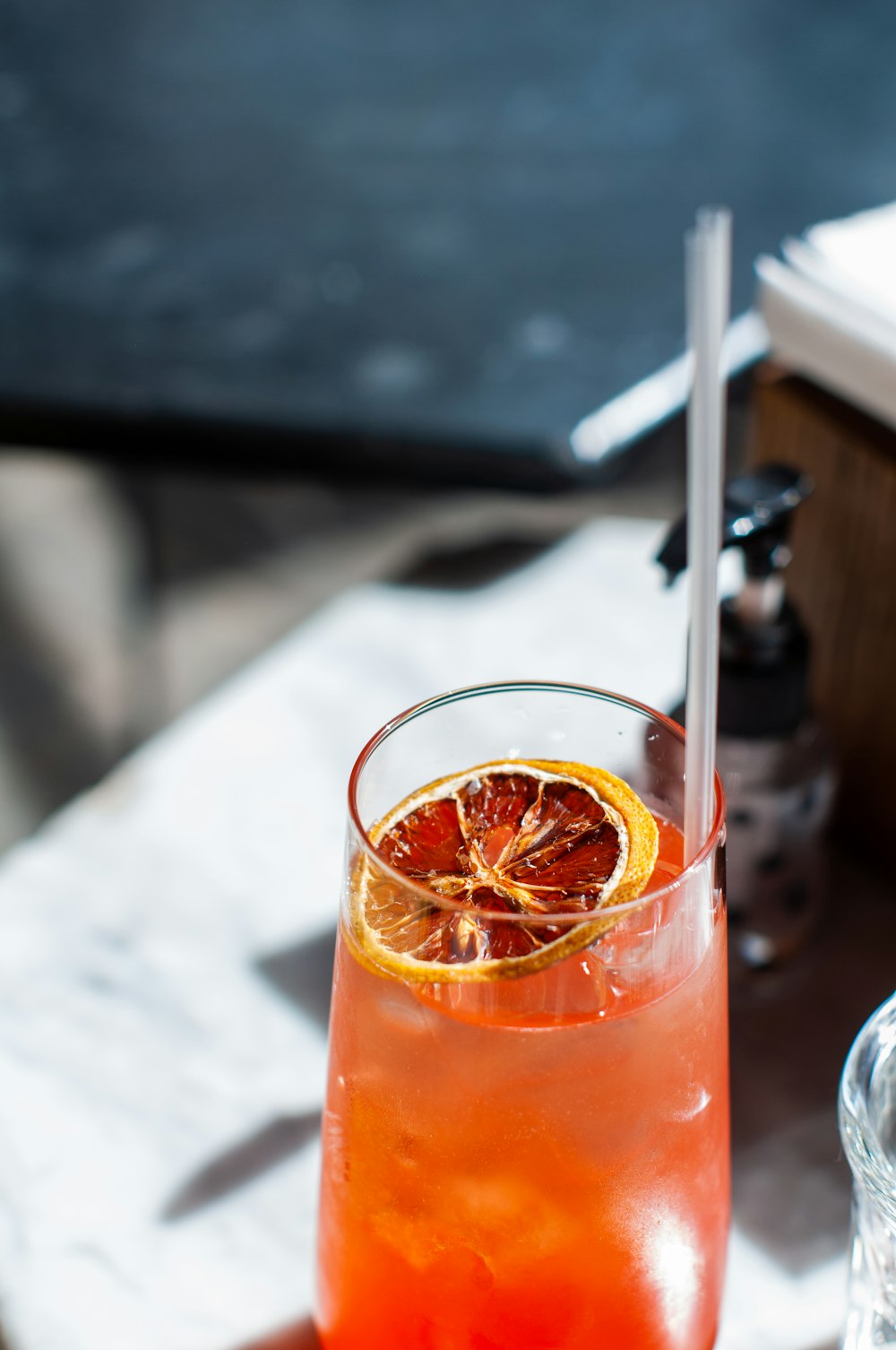 clear drinking glass with orange liquid