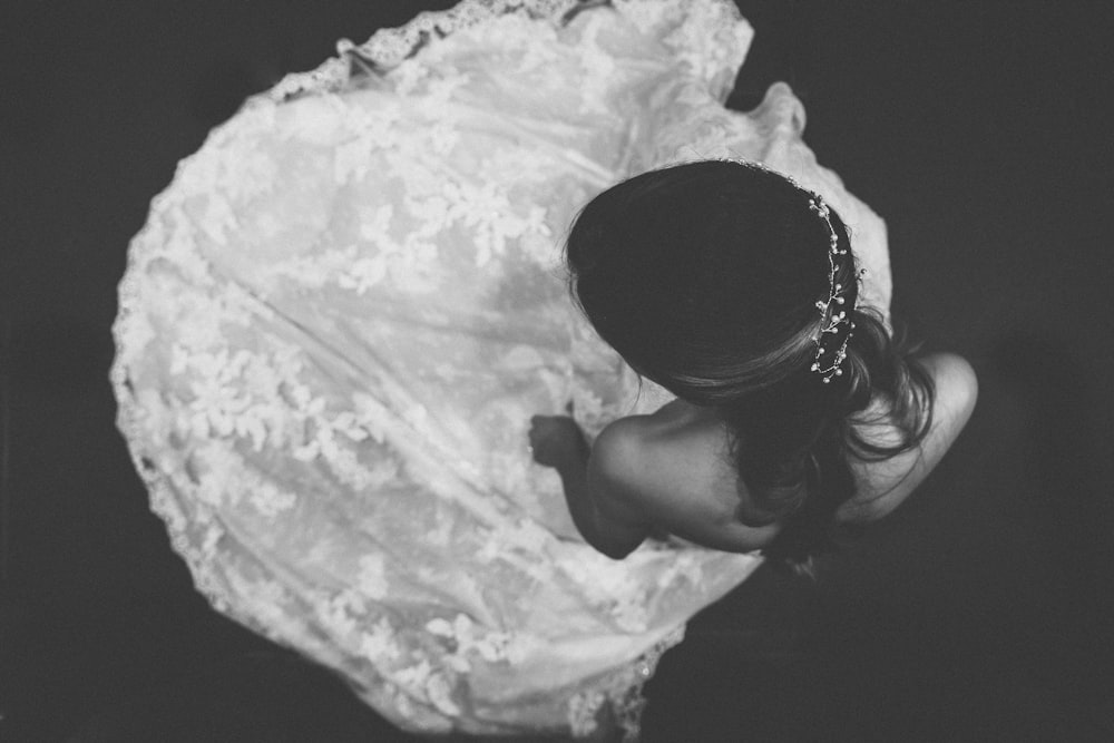 grayscale photo of woman in white floral dress