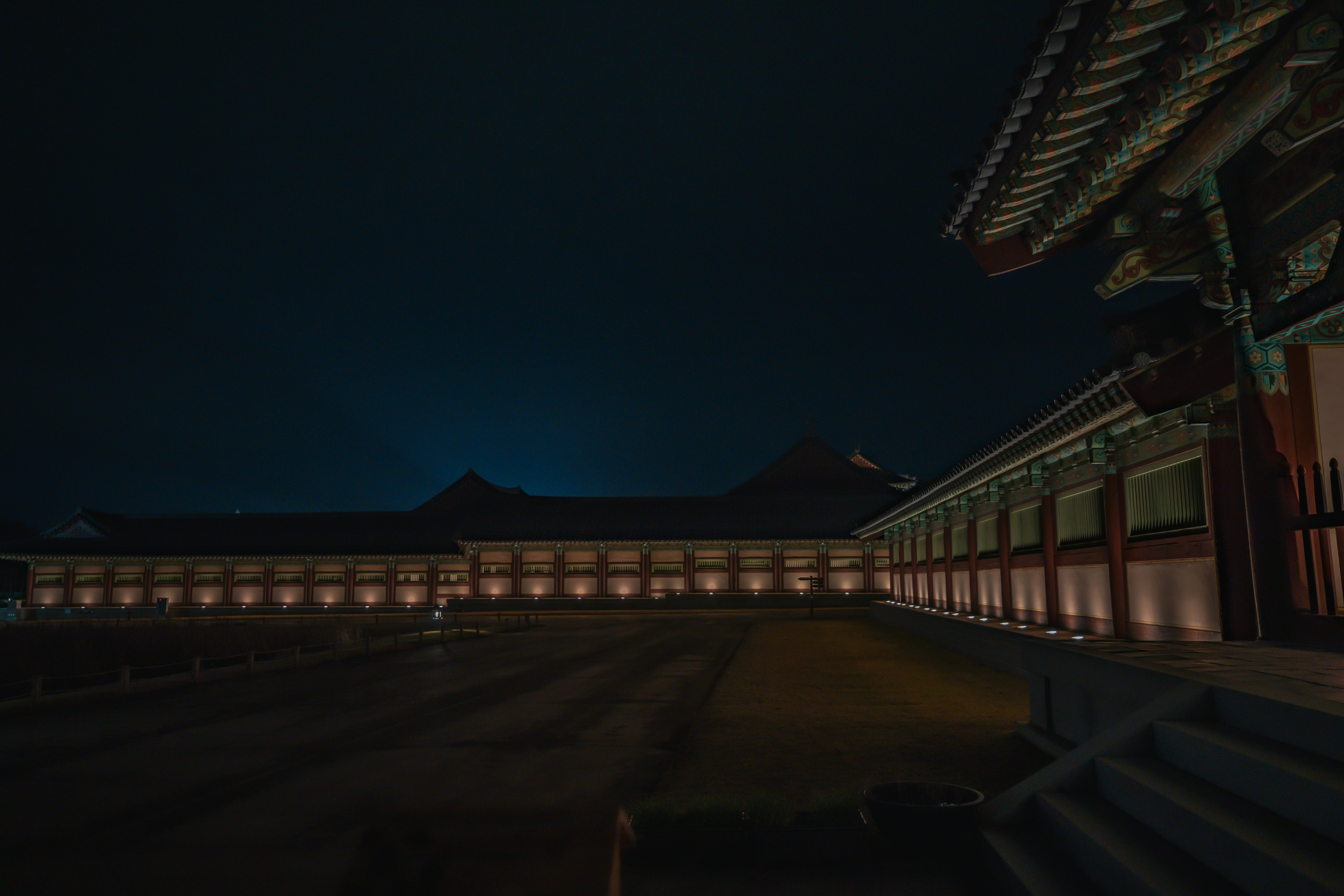 brown wooden bridge during night time