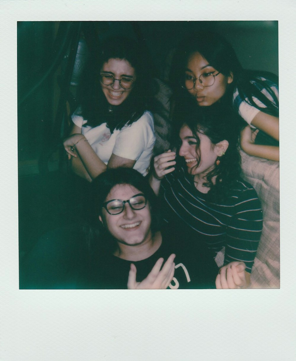 3 women smiling and standing