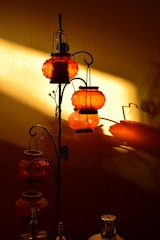Decorative Persian lamps casting warm light on the walls.