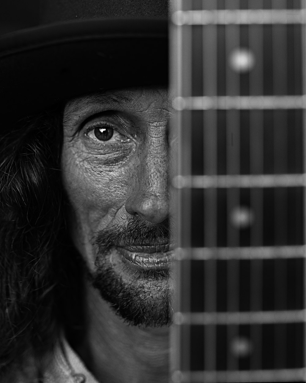 grayscale photo of man wearing hat