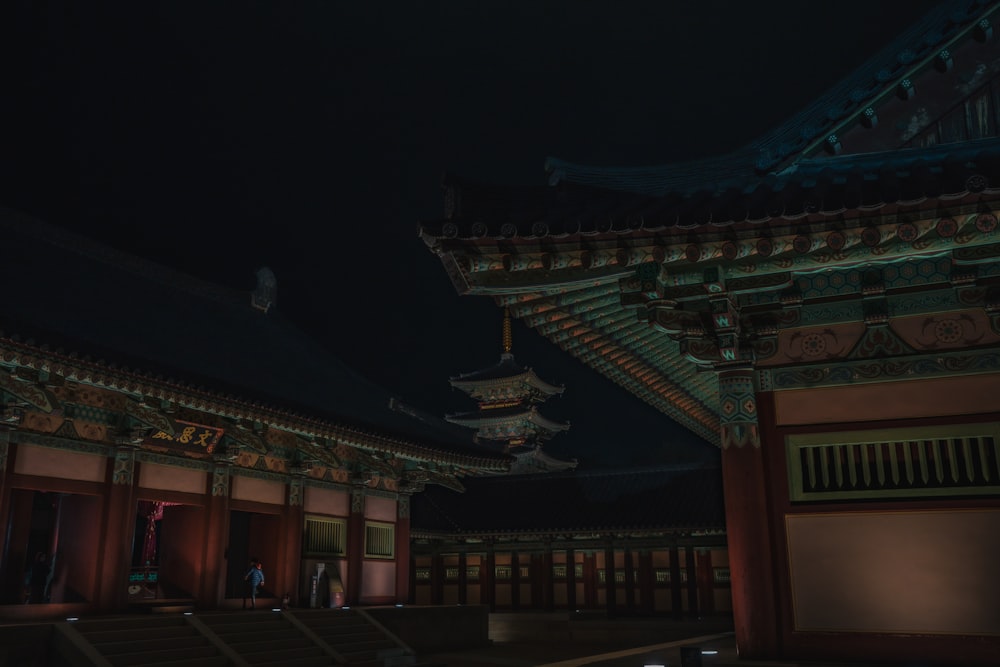 brown and green temple during night time