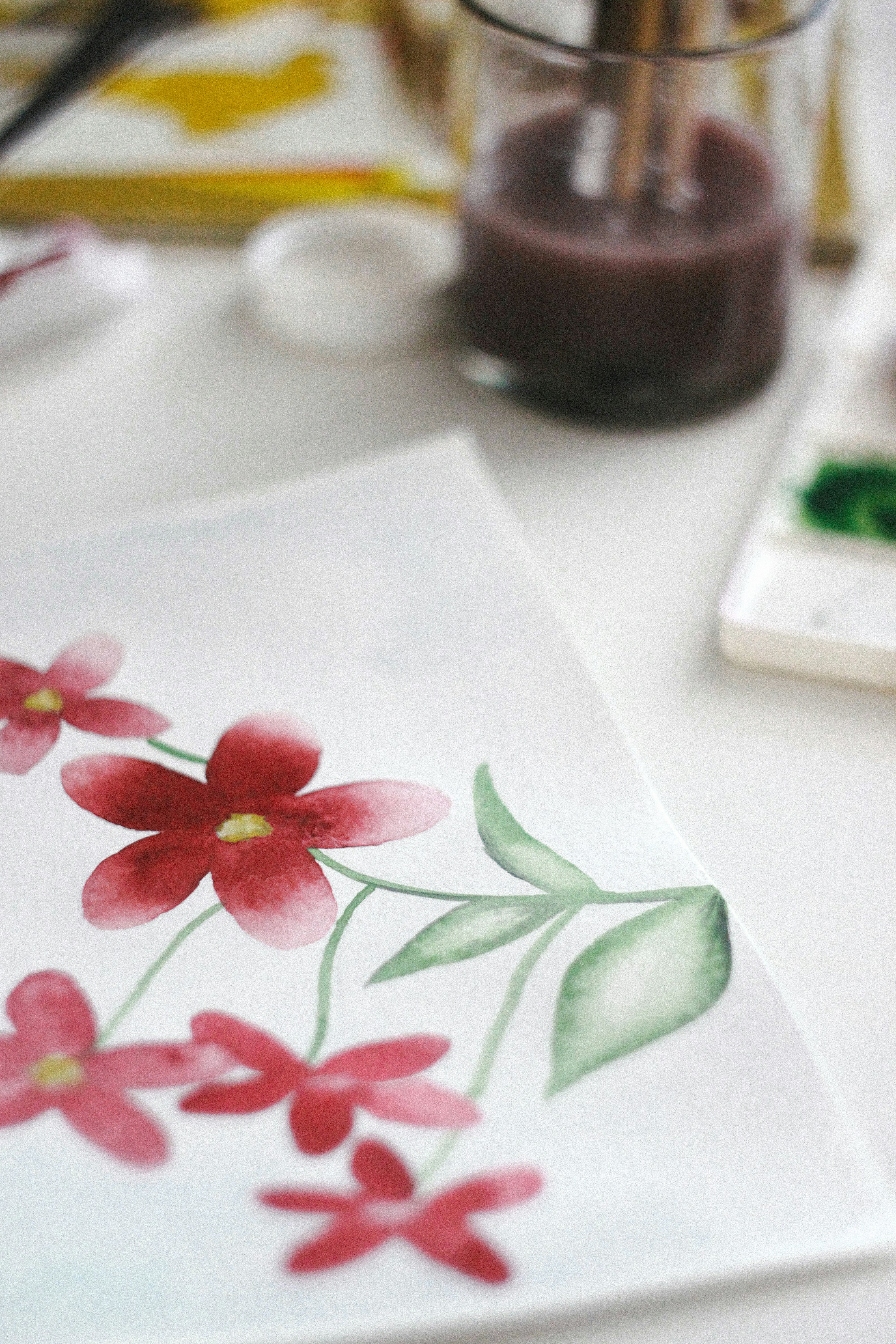 white pink and green floral textile