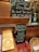 A display at Starbucks promoting a Diwali blend coffee. The setup includes a chalkboard with handwritten details, including flavor notes and pricing for the new blend. A basket with bottled juices and boxes of chocolates are also featured. A QR code stand is present for ordering options.