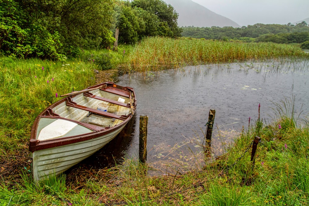 brown wooden boat on river during daytime