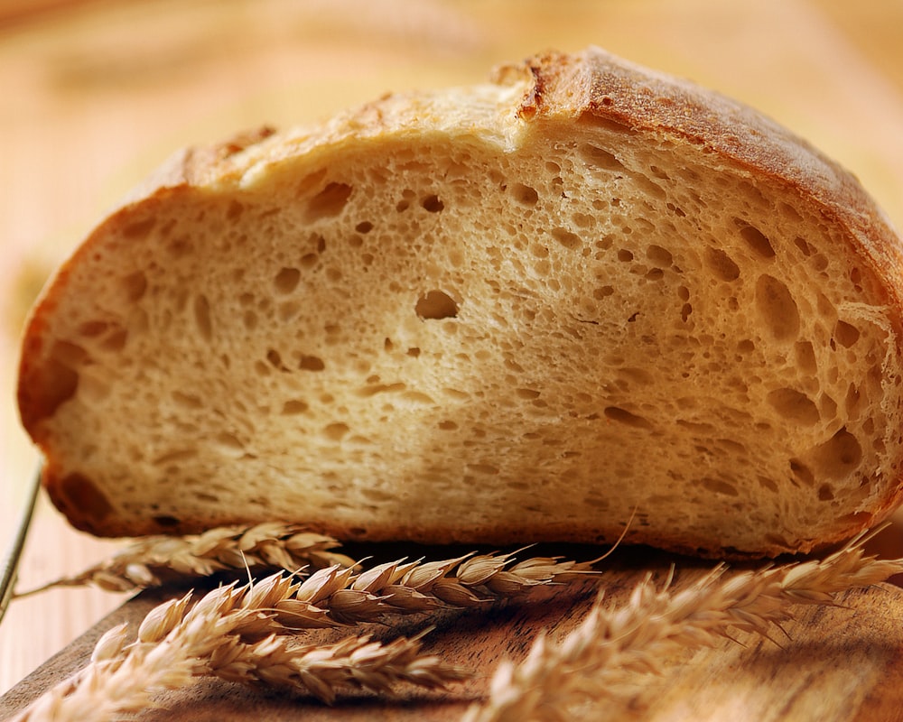 brown bread on white textile