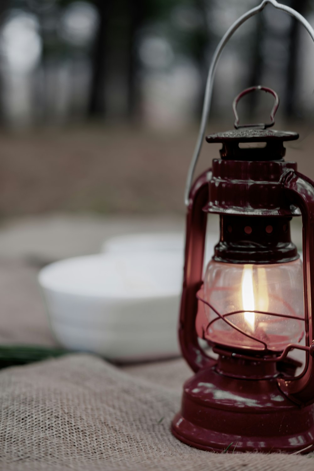 red lantern on green grass during daytime