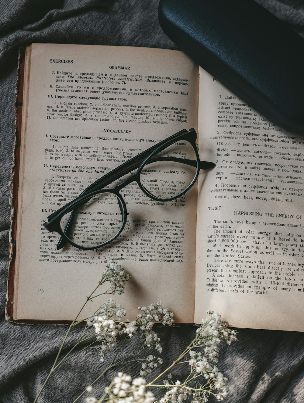 black framed eyeglasses on white printer paper