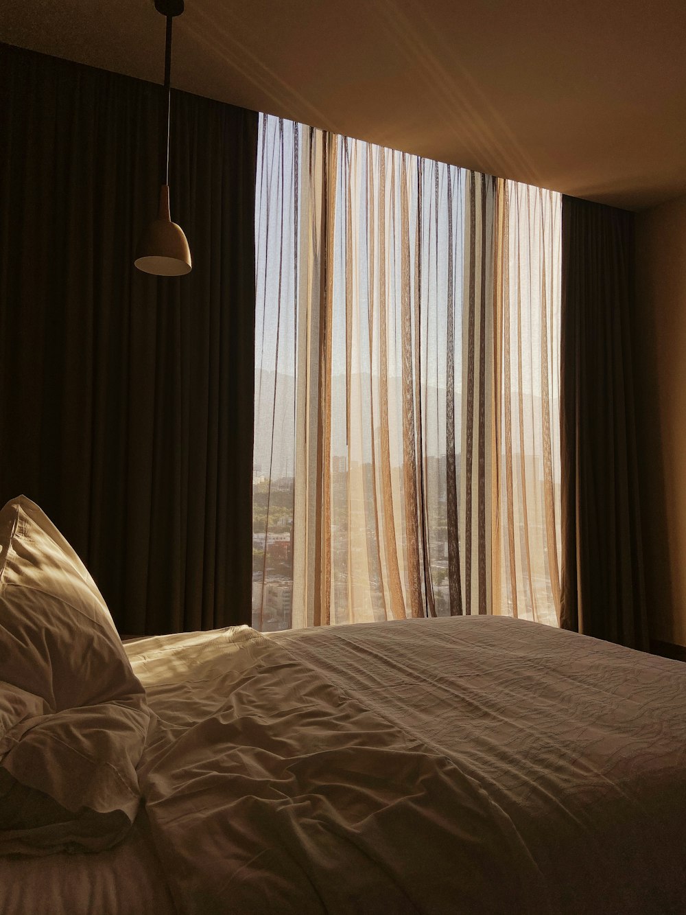 white and brown window curtain